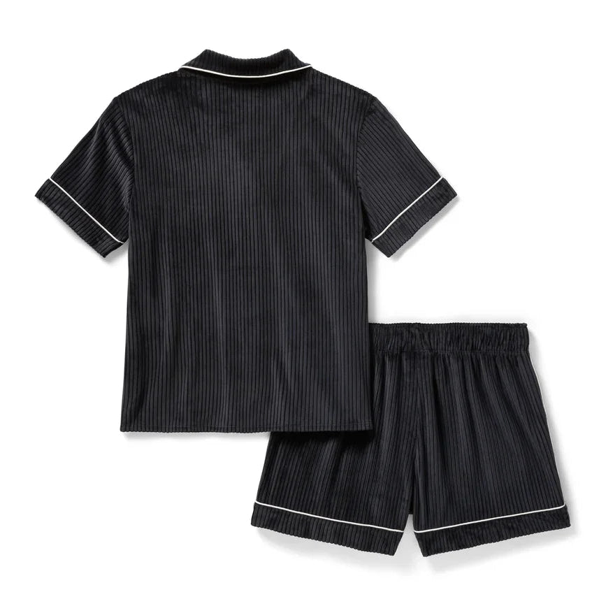 Black pinstripe pajama set with white trim on a white background
