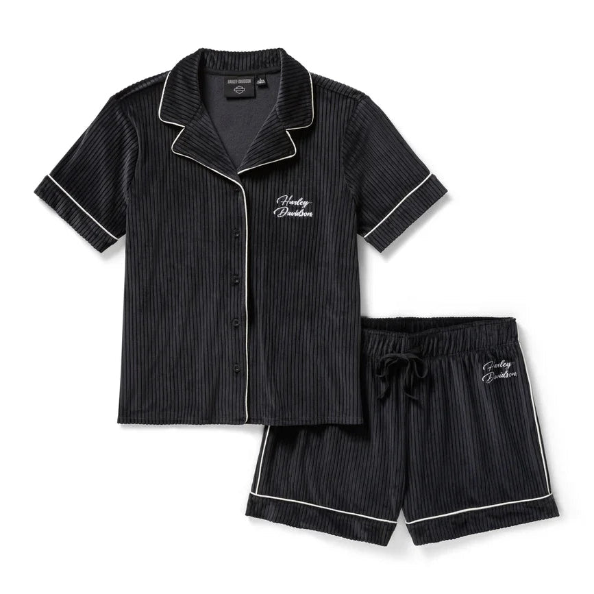 Black pinstripe pajama set with white piping on a white background