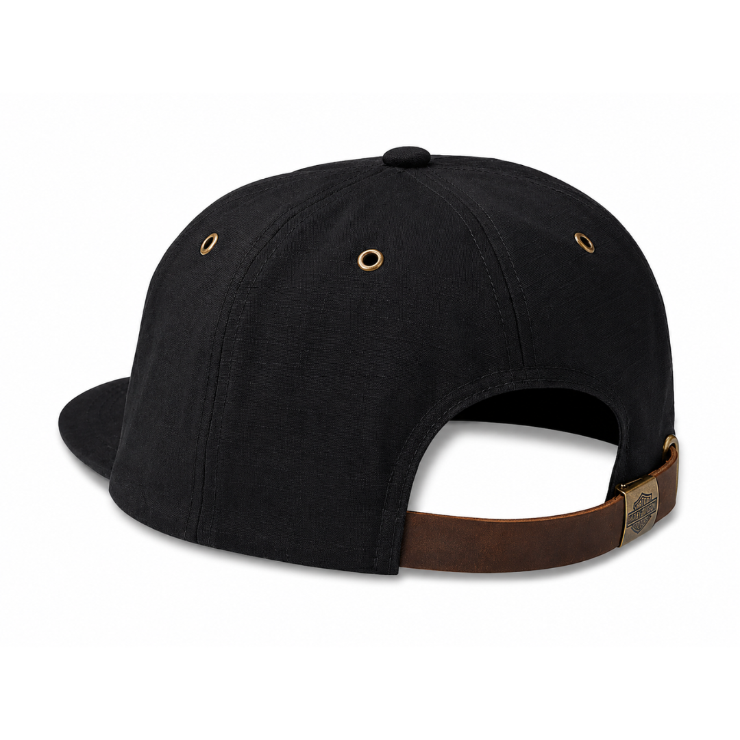 Black cap with brown leather strap on a white background