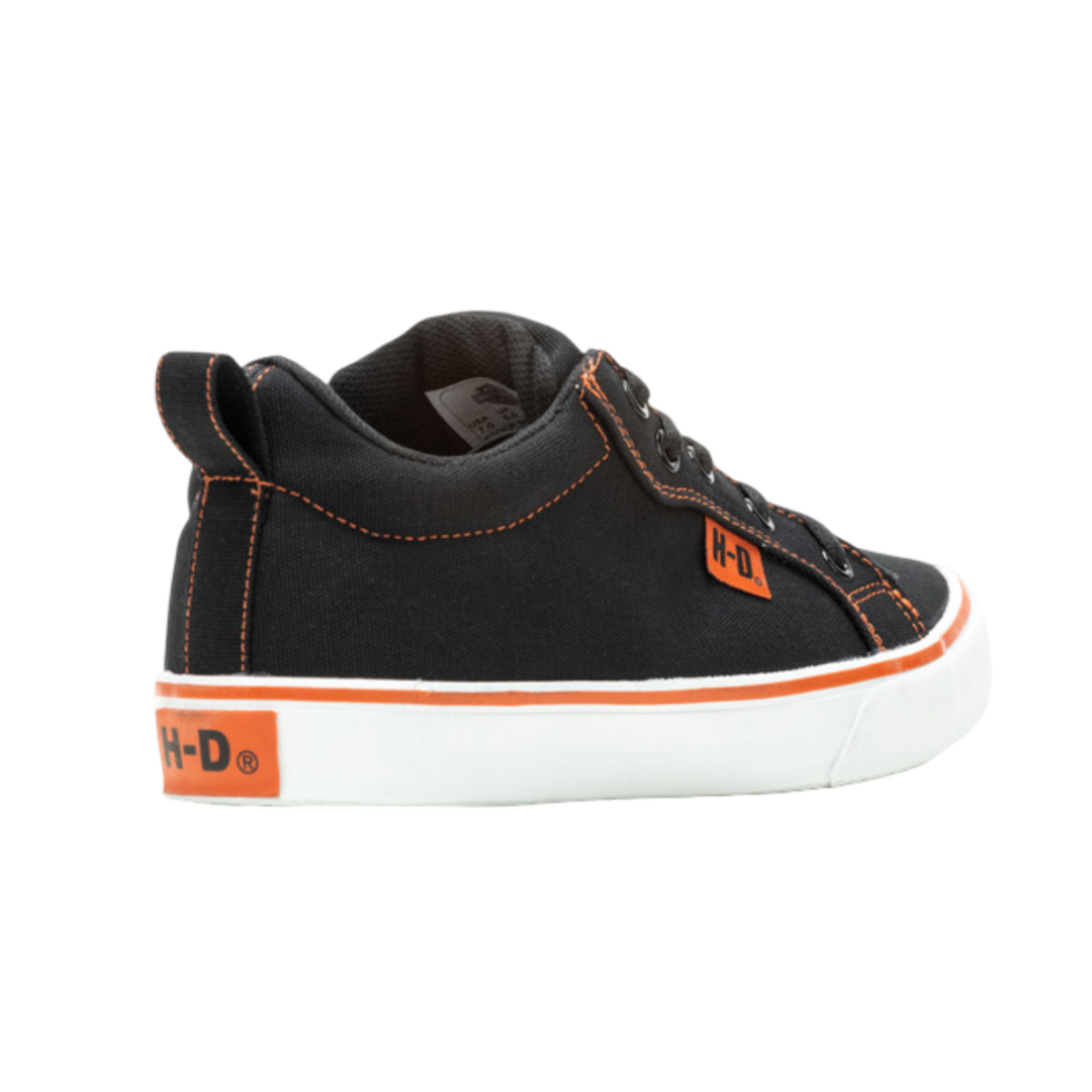 Black sneaker with orange accents on a white background